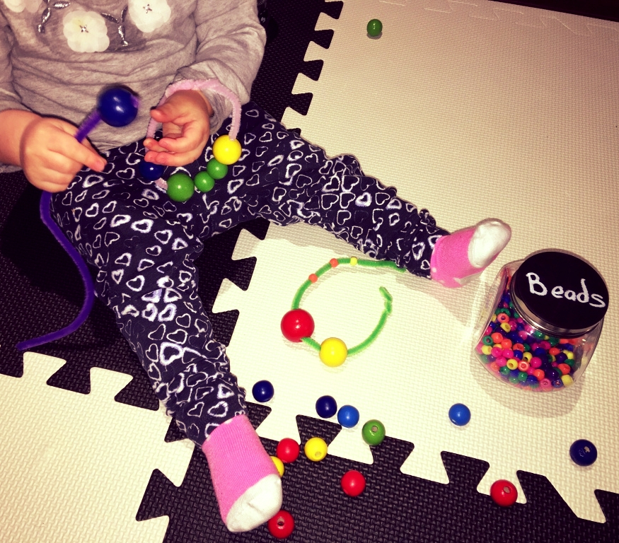 Not only is this a great activity for motor skills, you can also use it to match and sort (beads of the same size or colour) and it helps them learn to stay focused.