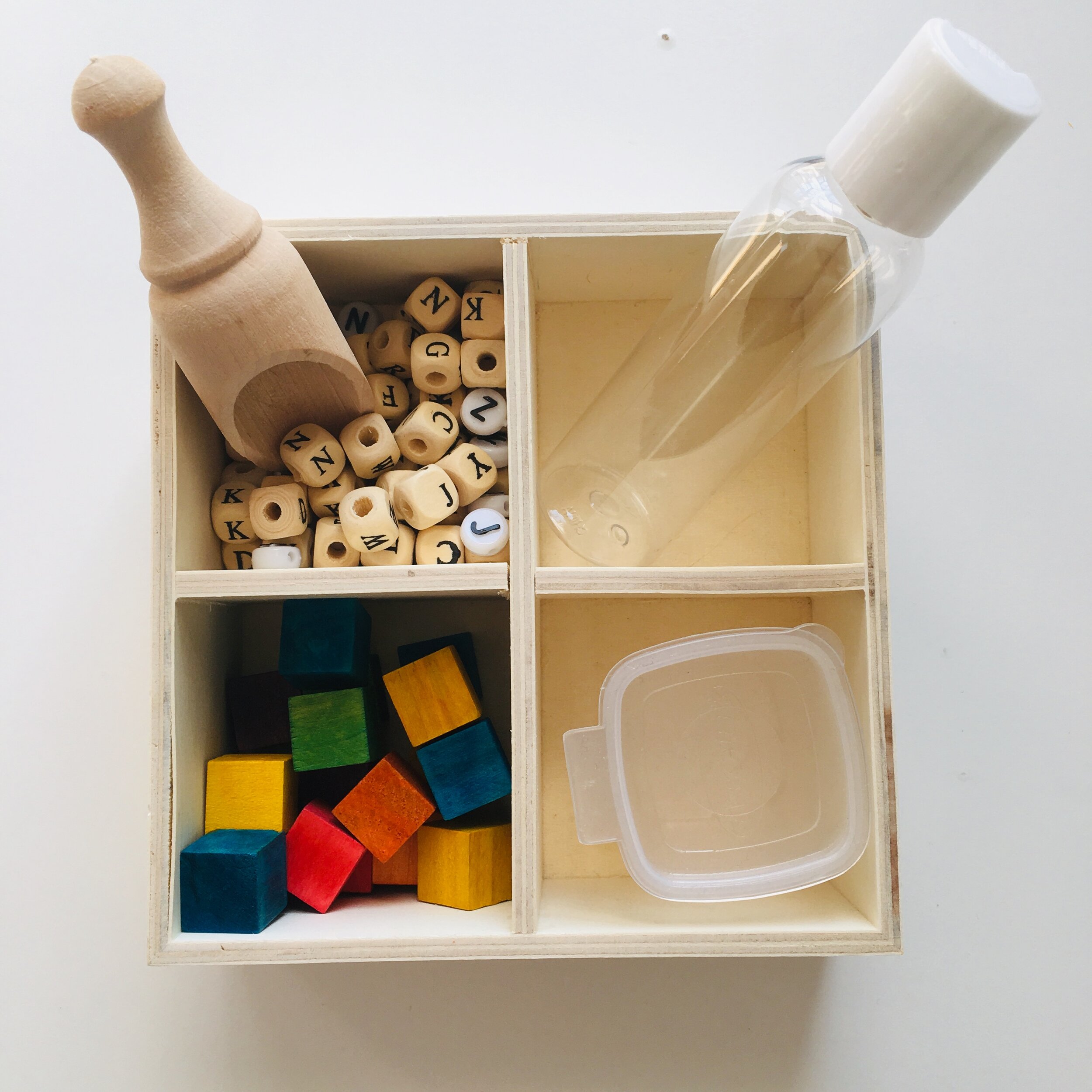 A set up for my kids play shelf. Small parts and containers. They used this set up to pretend they were cooking something.