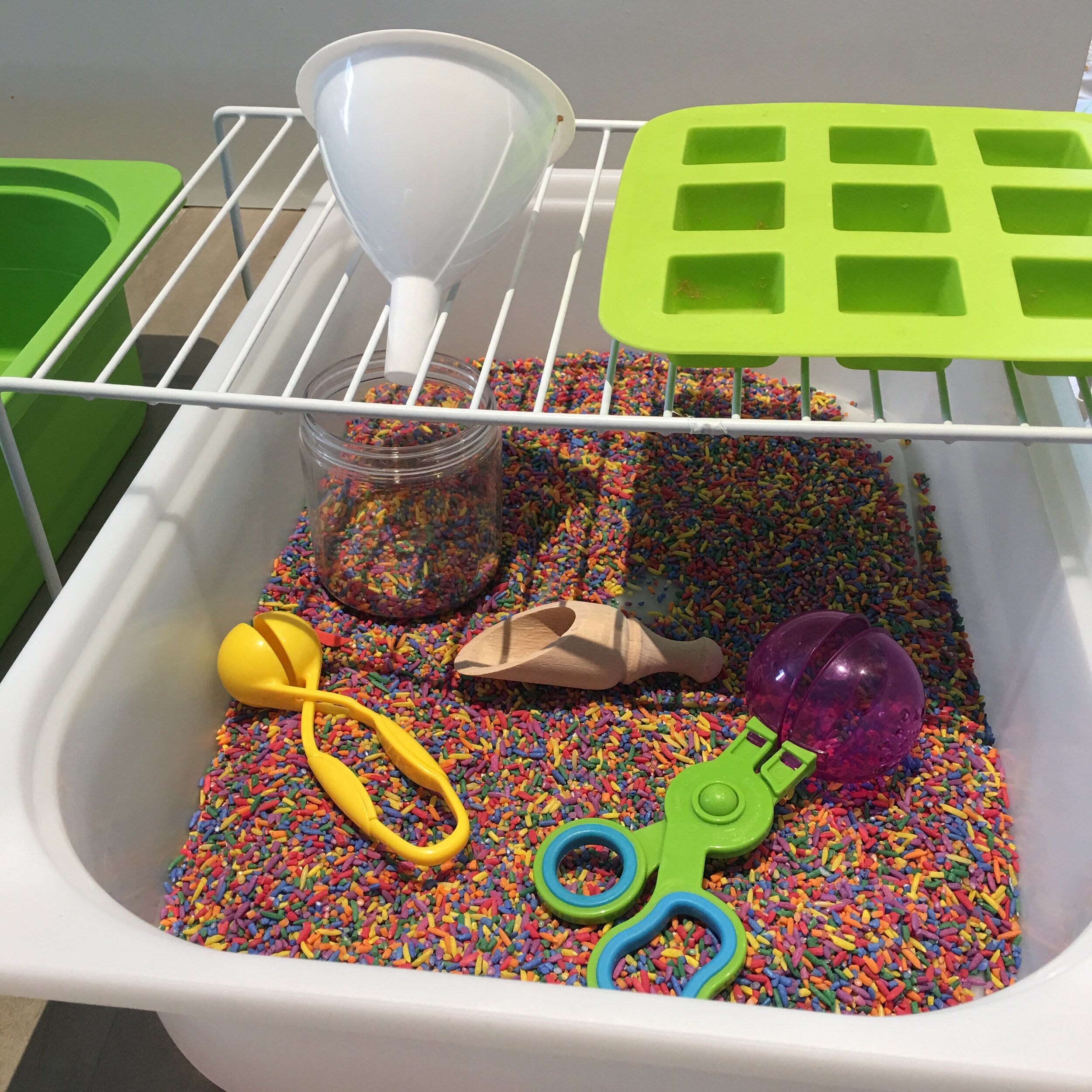 I have coloured rice in this bin (I just add some white rice to a Ziplock and add kids paint to it…shake to cover the rice and lay it flat out to dry on parchment paper)