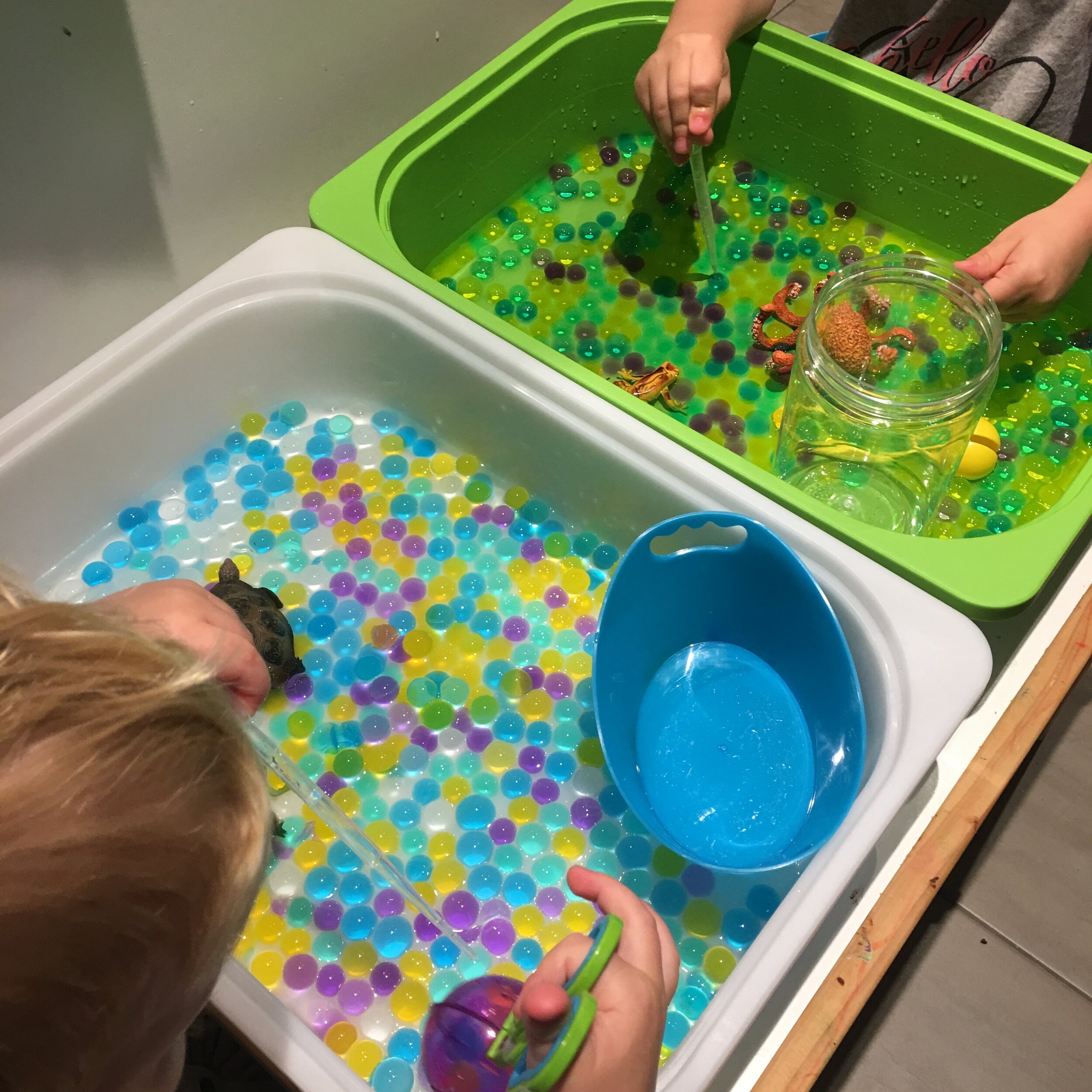 Each one of my kids has their own IKEA TROFAST bin. I also have a larger one for them to play with. I have some water beads in their bins here.